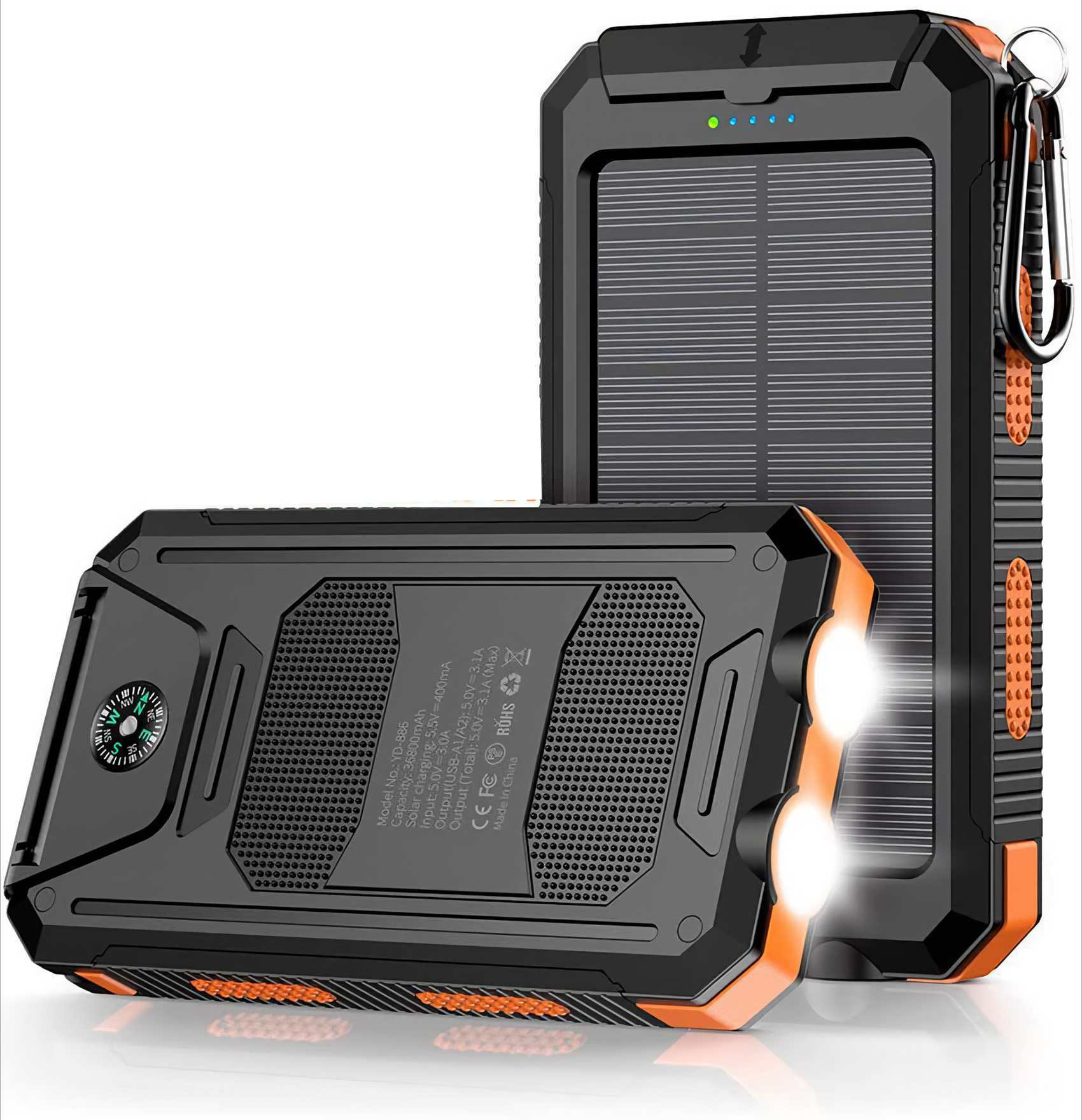 Schwarzes und oranges Solar Ladegerät mit zwei hellen Lichtern und einem Kompass. Es hat ein Solarpanel und einen Karabiner.
