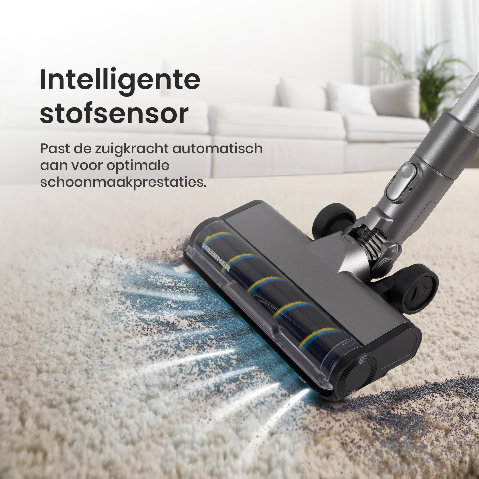Une tête d'aspirateur grise nettoyant un tapis beige. Texte en néerlandais : 'Capteur de poussière intelligent'.