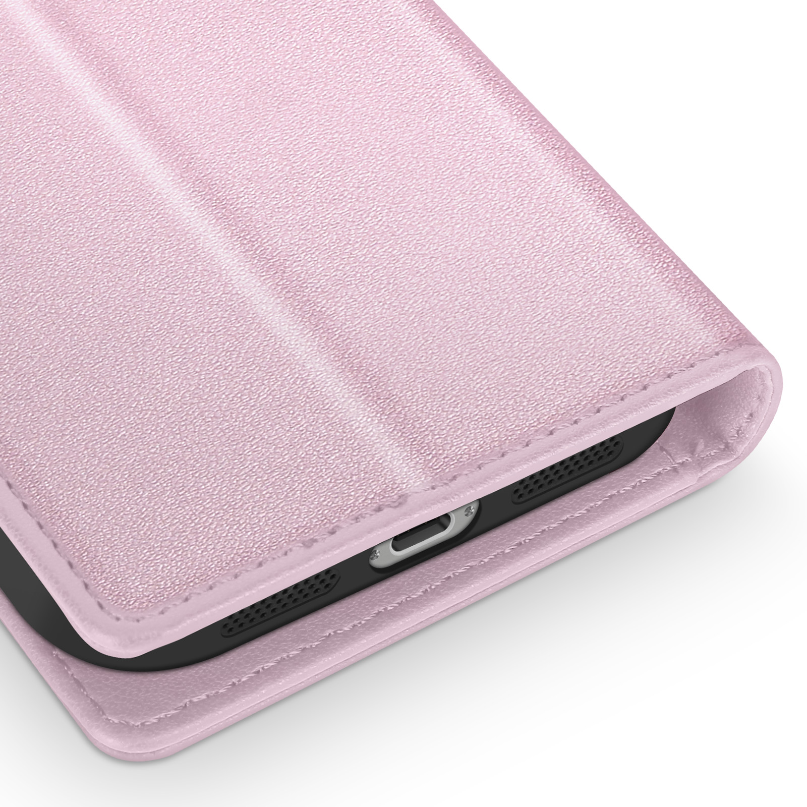 Primo piano di una custodia rosa per telefono. La custodia ha una superficie strutturata e un telefono nero è visibile all'interno.