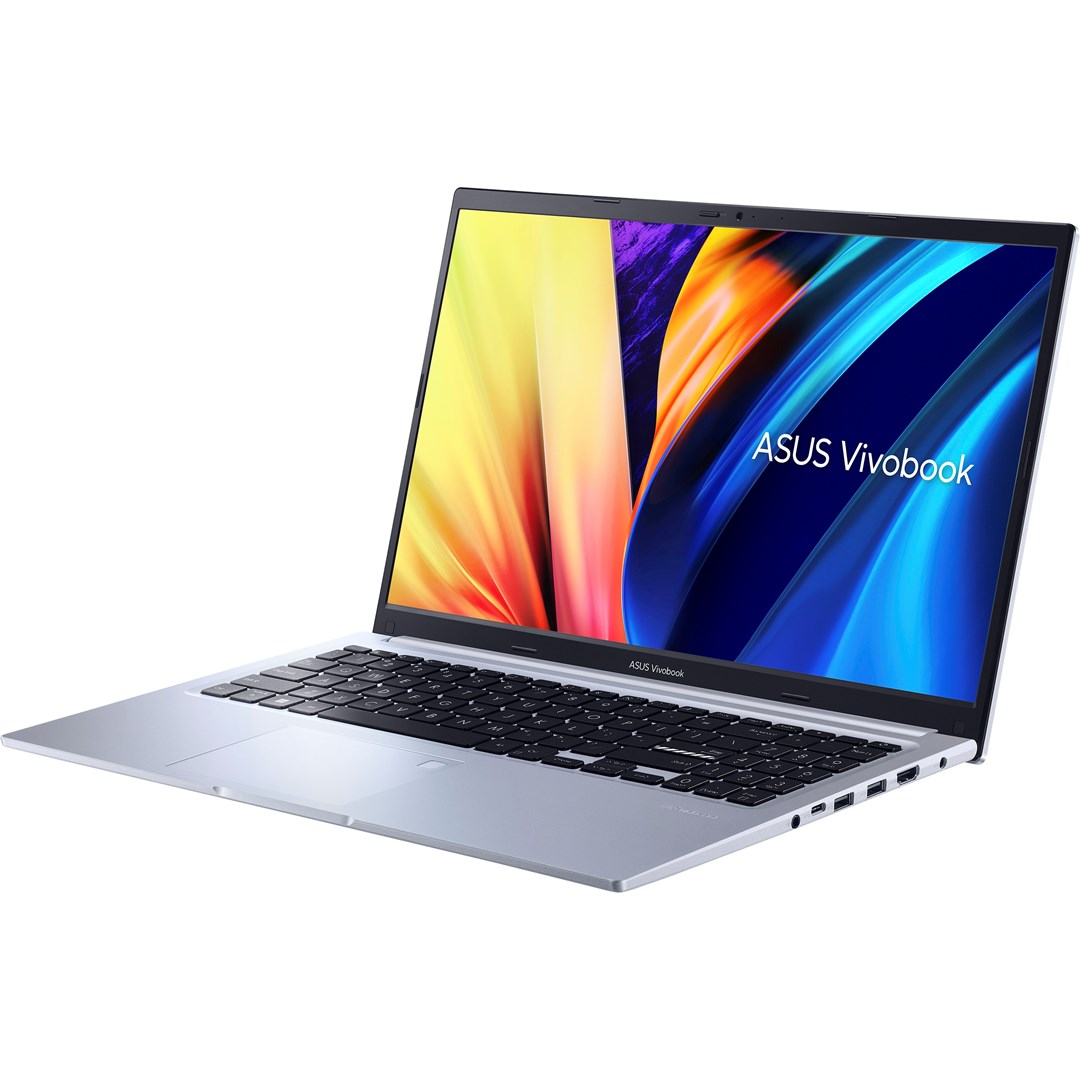 Laptop ASUS Vivobook jest otwarty. Ekran wyświetla kolorową grafikę. Widoczna klawiatura i touchpad. Laptop stoi na białej powierzchni.
