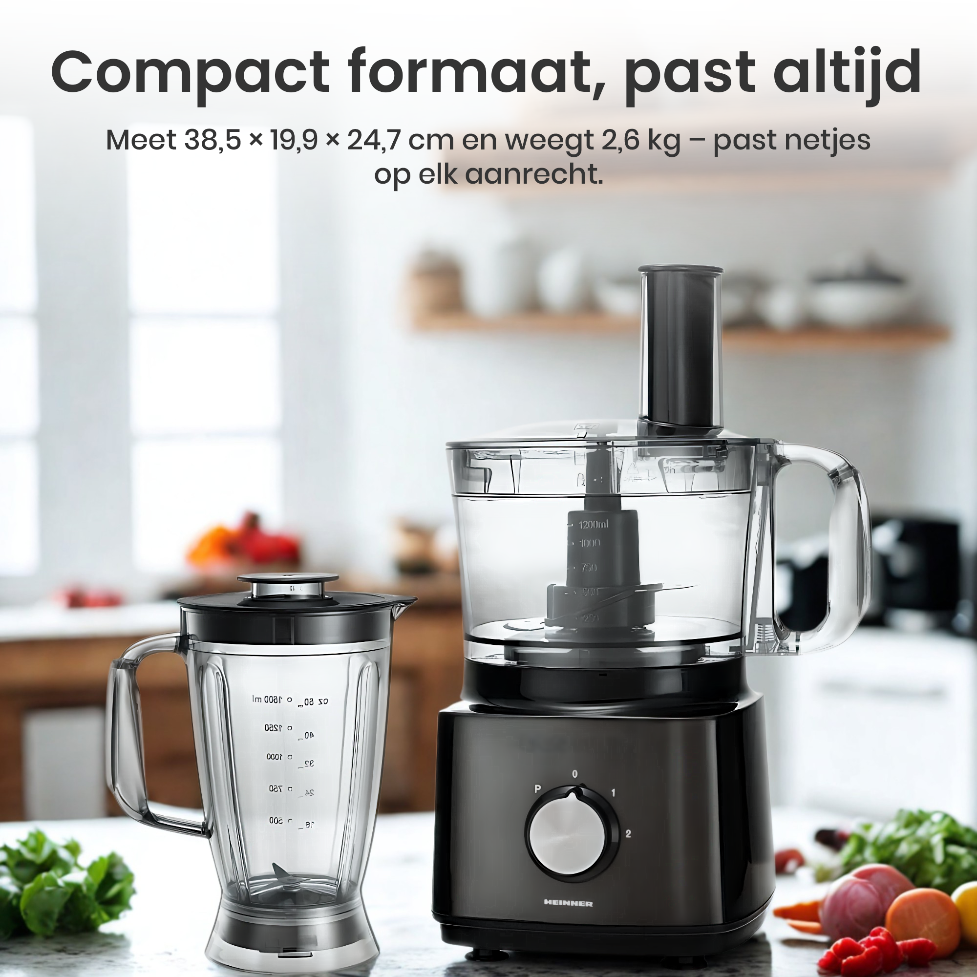 A food processor and blender sit on a counter. The processor is black, with a clear container. Vegetables are in the background.