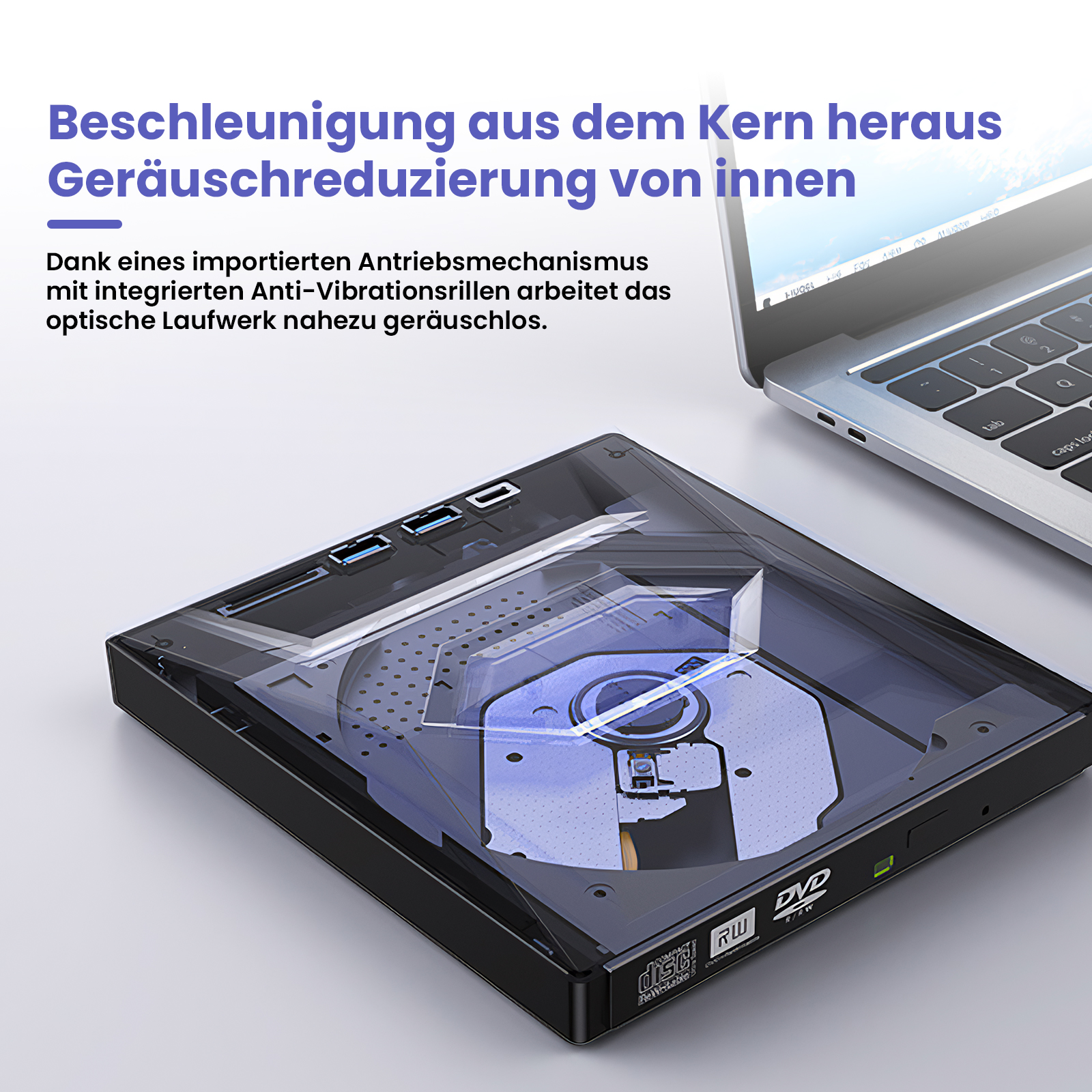 Ein schwarzes externes DVD-Laufwerk mit transparentem Deckel, im Hintergrund ein Laptop.