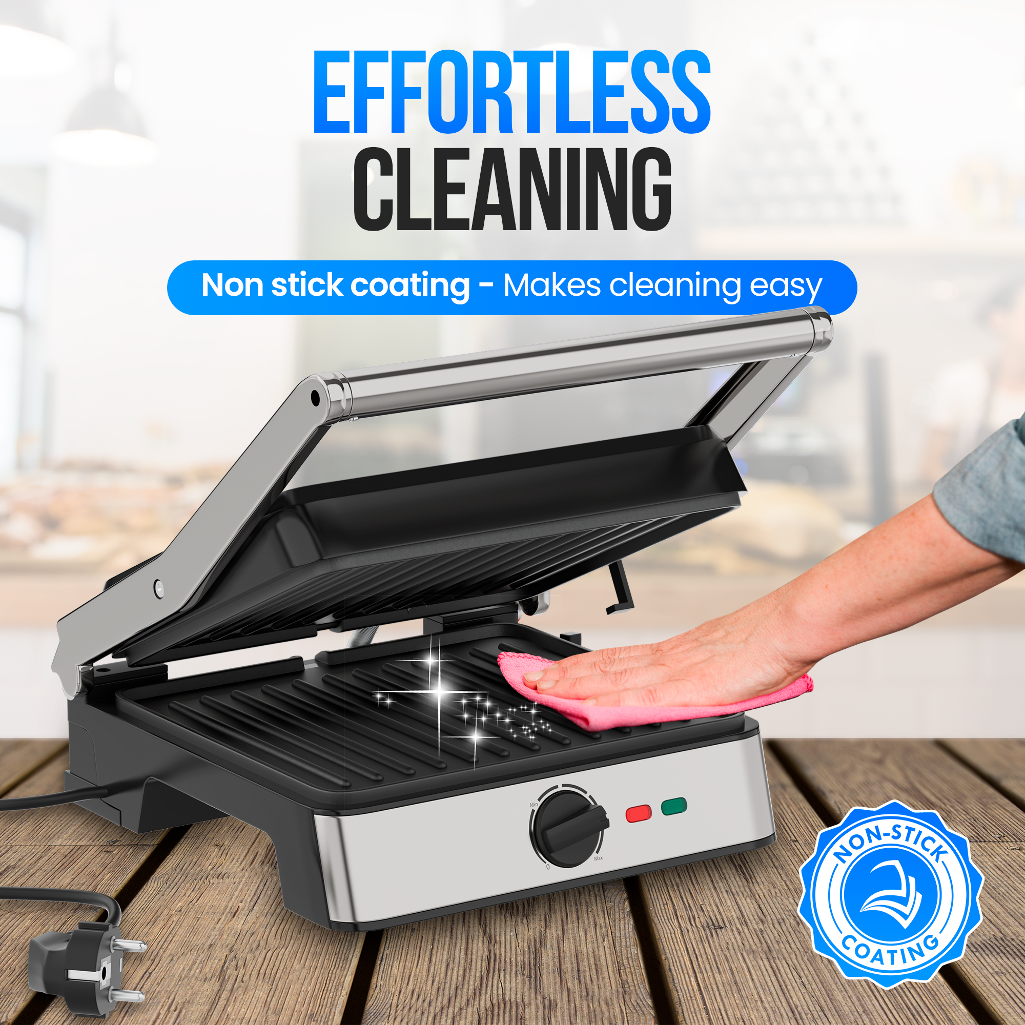 A person cleaning a non-stick grill with a pink cloth. The grill is on a wooden table, and it has a non-stick coating.