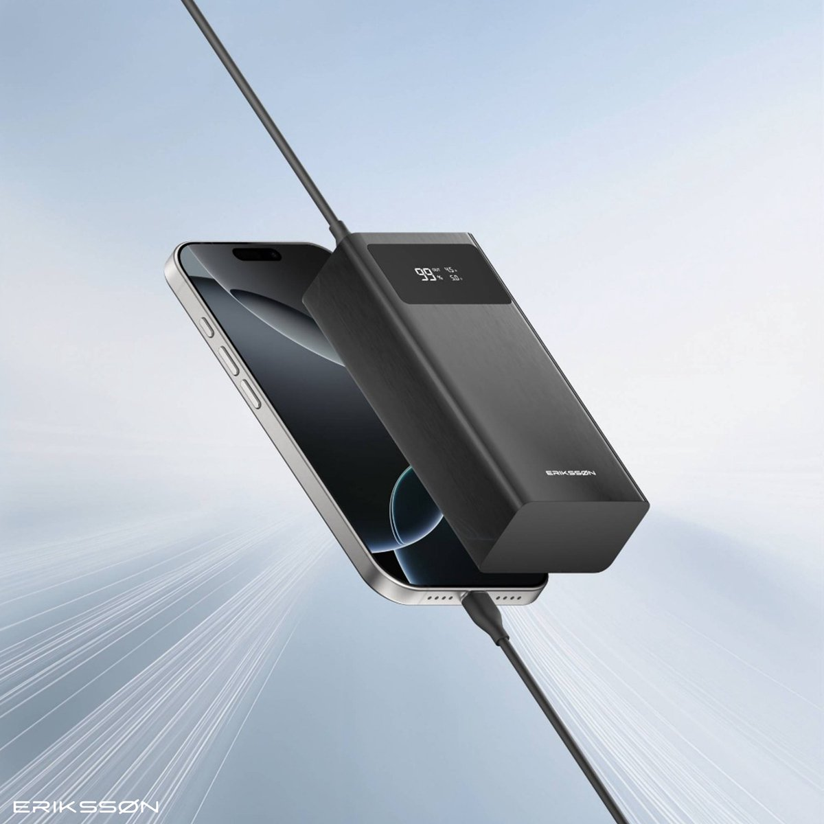 A phone is connected to a black power bank via a cable. The power bank displays 99%. The background is a gradient of blue and white.
