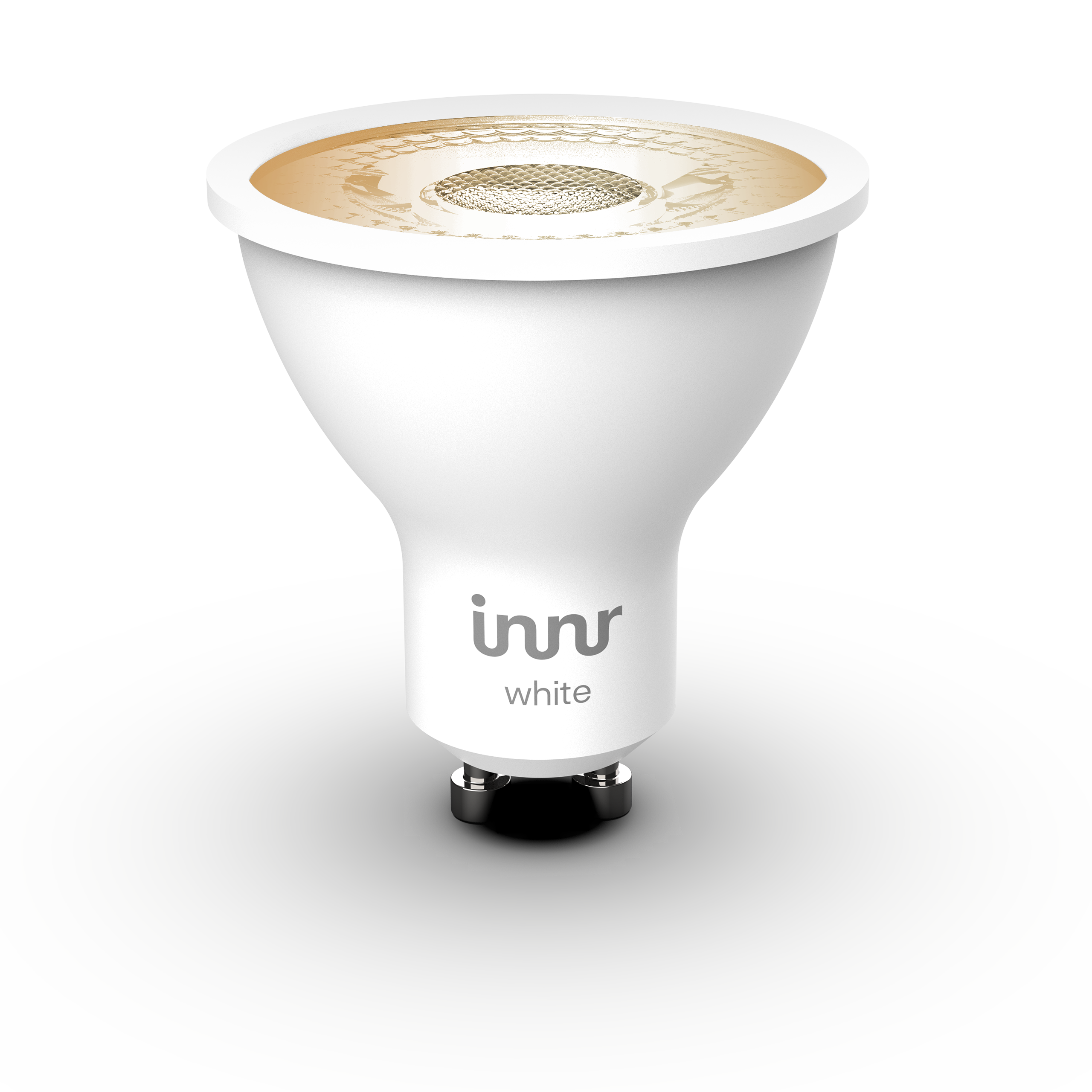 Une ampoule LED Innr blanche, sur une surface blanche, avec un fond noir. L'ampoule a une base argentée.