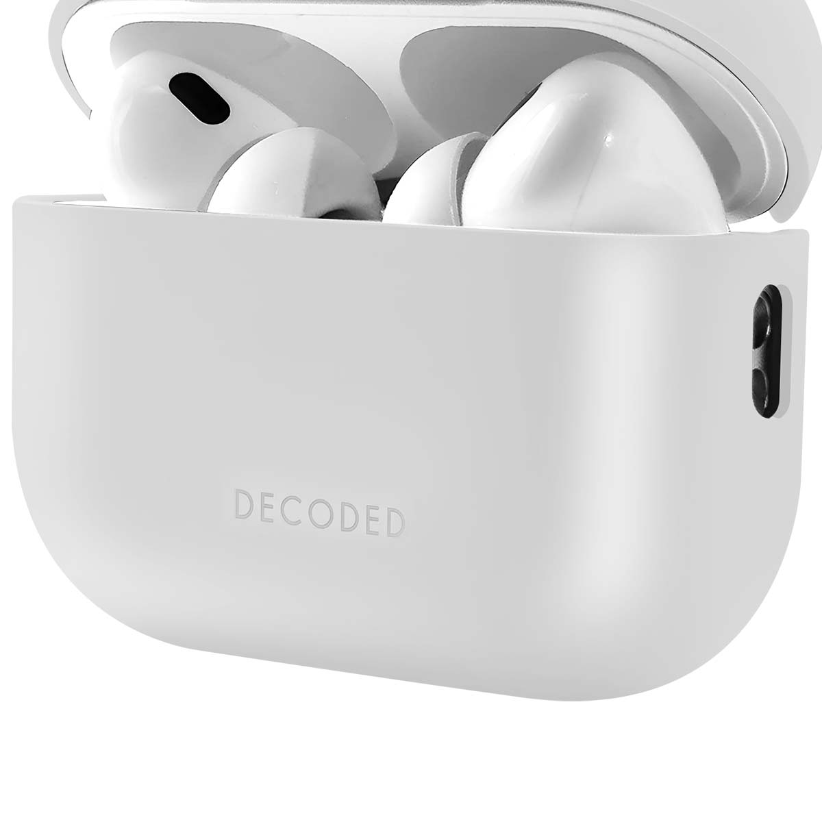 White AirPods in a charging case, the case is open. The brand 'DECODED' is on the front of the case.