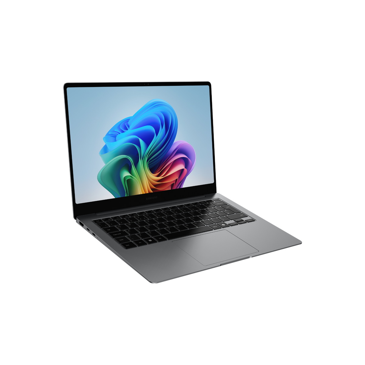 Una laptop gris está abierta, mostrando una imagen abstracta colorida en la pantalla. El fondo es negro.