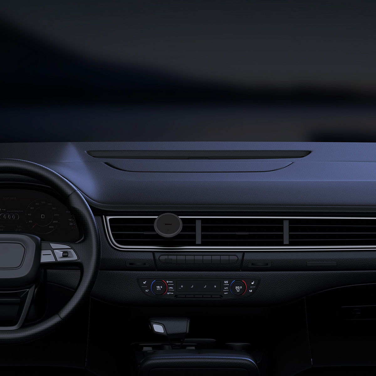 Wnętrze samochodu. Widoczna deska rozdzielcza, kierownica i kratki wentylacyjne. Uchwyt na telefon zamontowany na kratce.