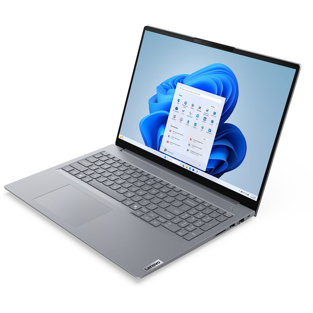 A Lenovo laptop is open, displaying a Windows 11 interface. The screen shows a blue abstract background with an app menu.
