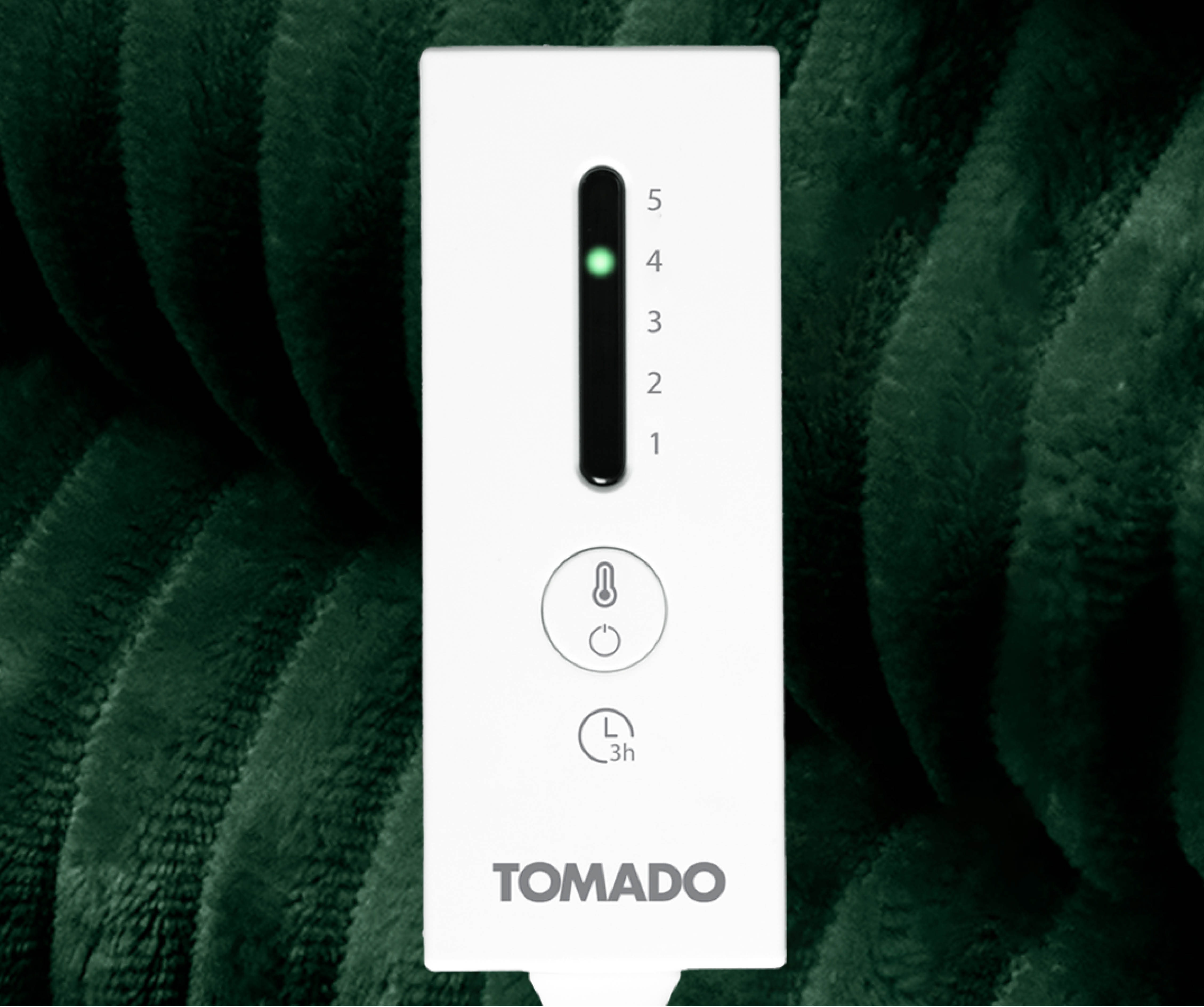 White control panel with green light, numbers, and symbols, against a dark green textured background.