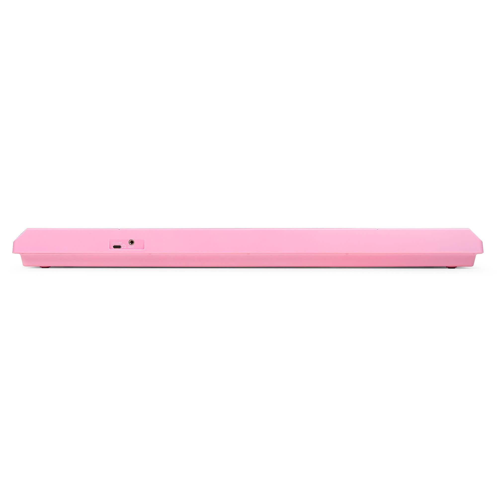 Un teclado rosa, visto de lado. Tiene una entrada de energía, una entrada de micrófono y un botón de encendido.