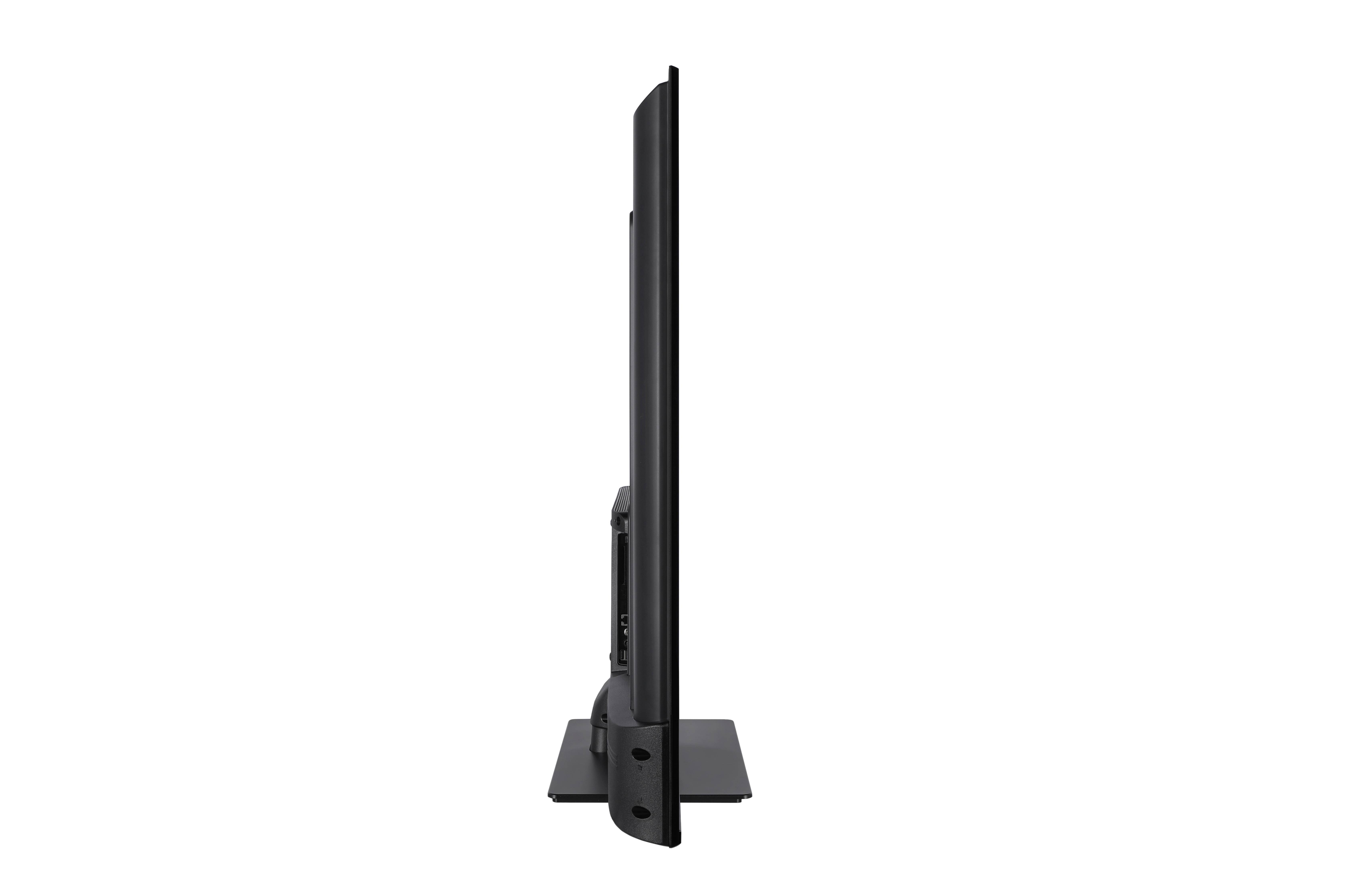 Vue latérale d'une télévision noire moderne sur fond blanc. Elle repose sur un socle noir.