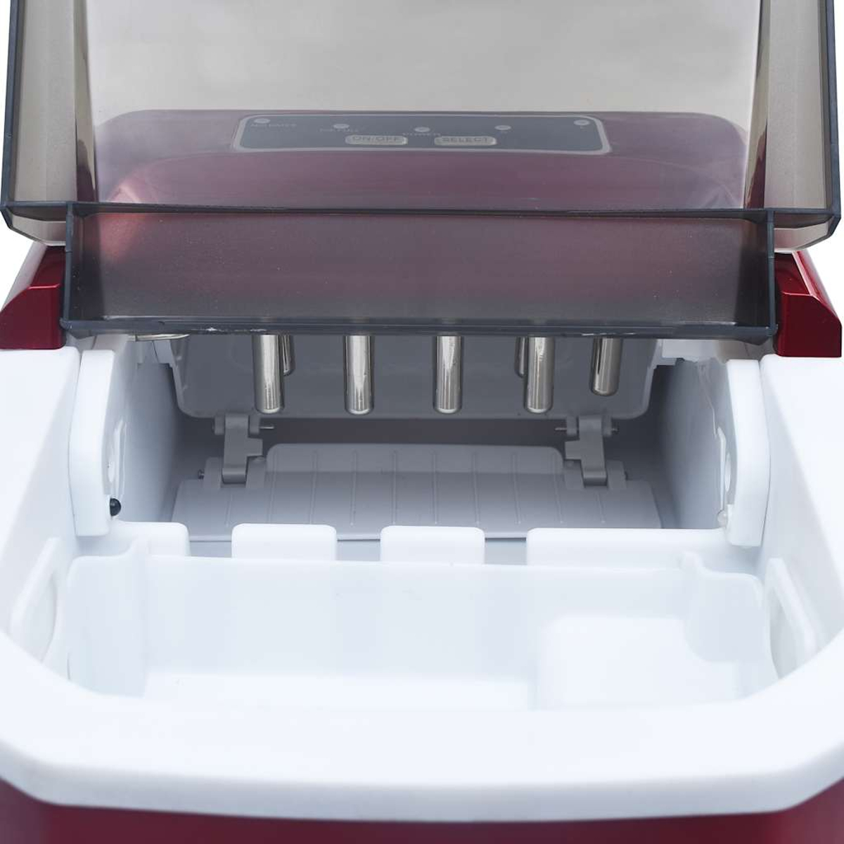 Una máquina de hacer hielo, abierta. Plástico rojo y blanco con varillas metálicas plateadas. La tapa es de plástico transparente.