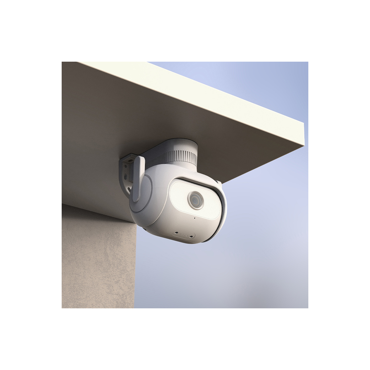 Biała kamera bezpieczeństwa zamontowana pod białym dachem. Kamera ma obiektyw i jest przymocowana do ściany.