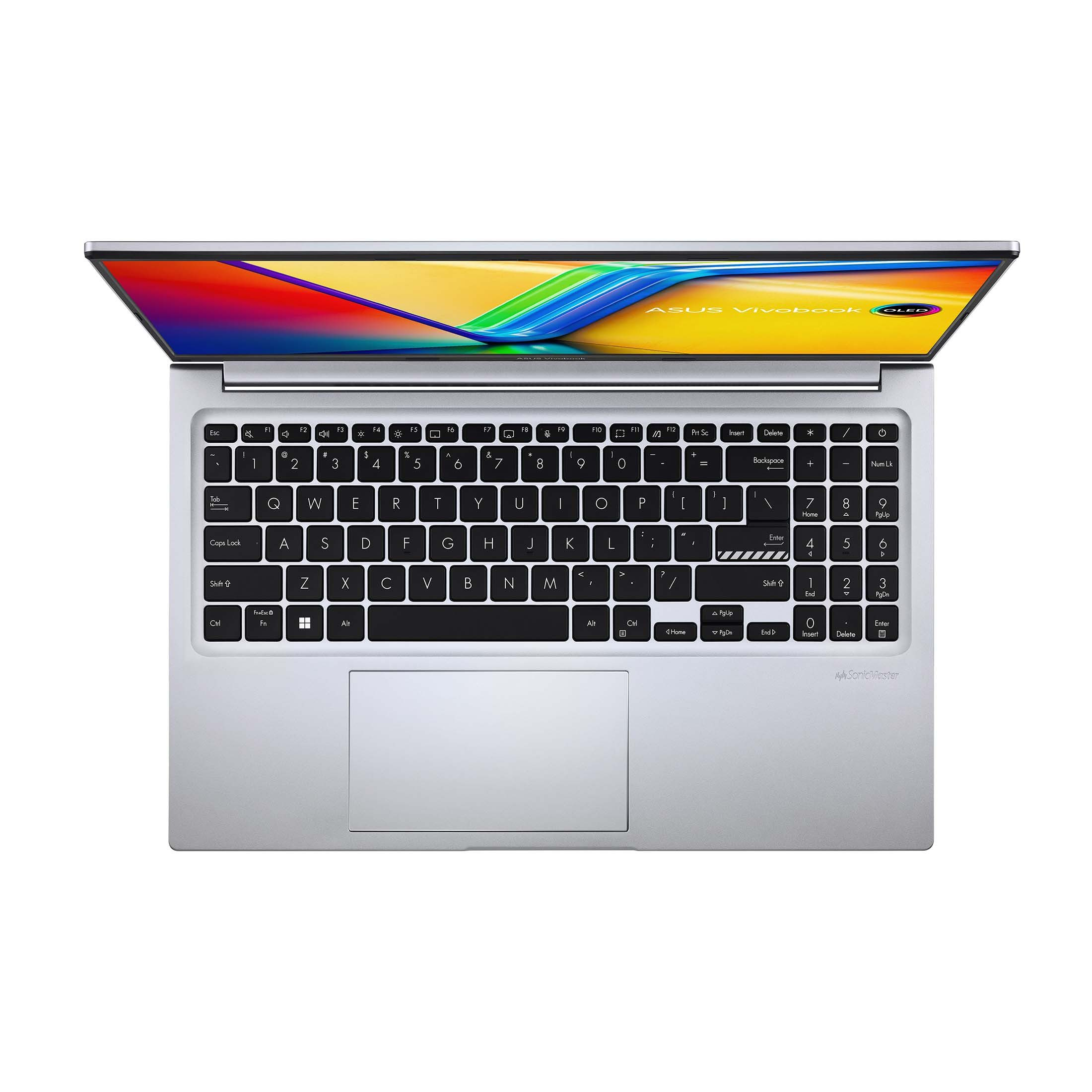 Ein silbernes Asus Vivobook Laptop ist auf einer weißen Oberfläche geöffnet. Der Bildschirm zeigt ein farbenfrohes Bild.