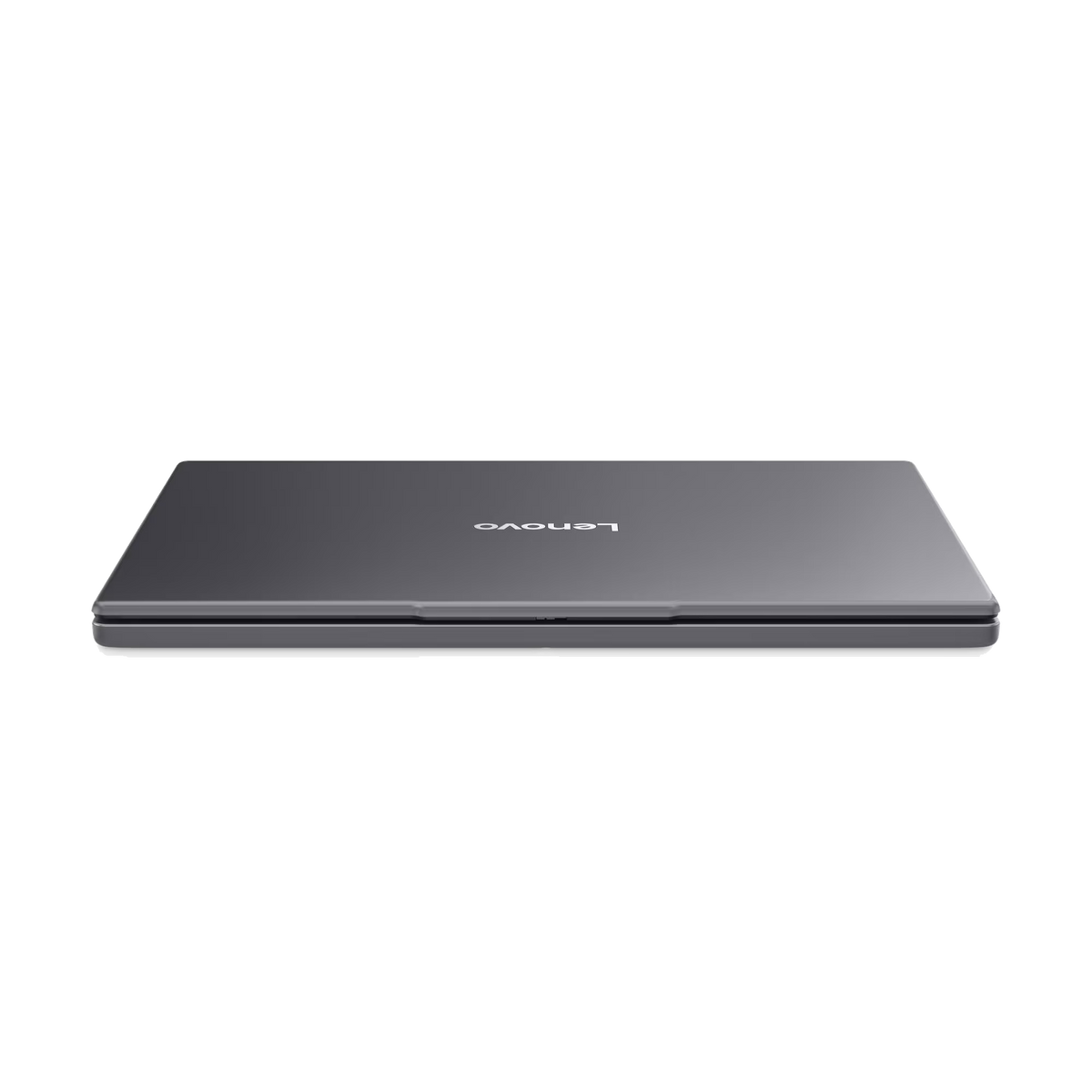 Un portátil Lenovo gris cerrado sobre un fondo negro. El logotipo de Lenovo es visible en la parte superior. El portátil está ligeramente inclinado.