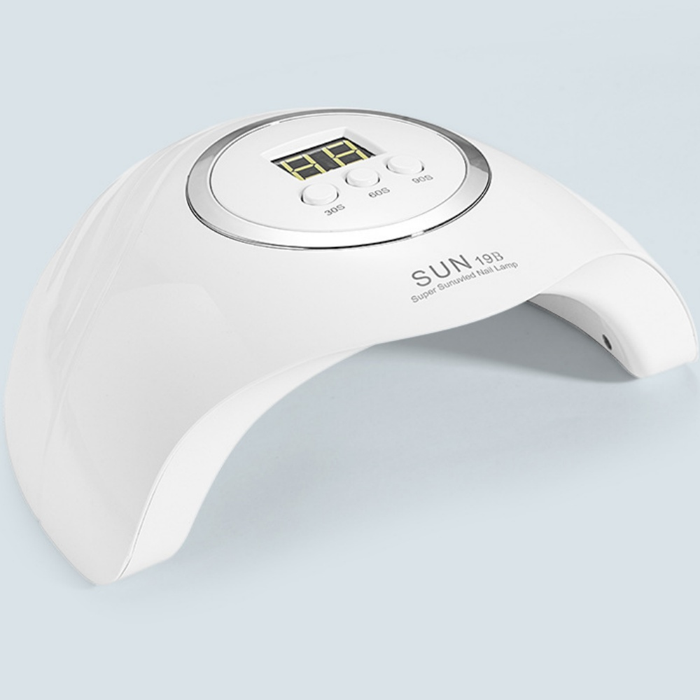 Weiße Nagellampe mit Digitalanzeige. Tasten für 30s, 60s und 90s. Der Text 'SUN 19B Super Sunuvied Nail Lamp' ist sichtbar.