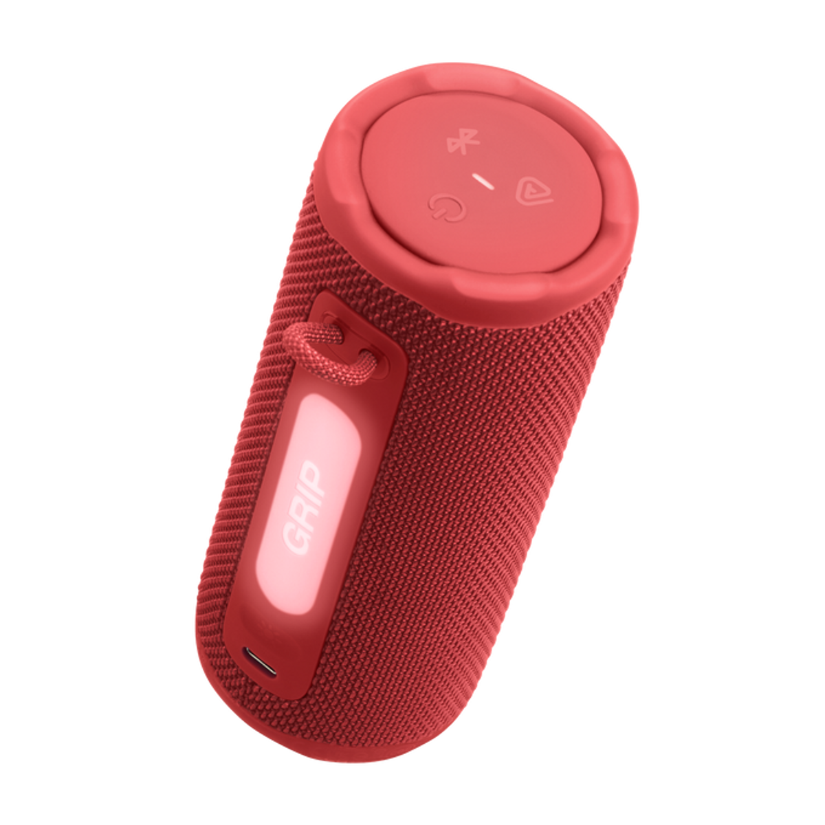 Ein roter zylindrischer Lautsprecher mit einem Griff mit der Aufschrift 'GRIP'. Oben befinden sich Bedienelemente. Der Hintergrund ist schwarz.