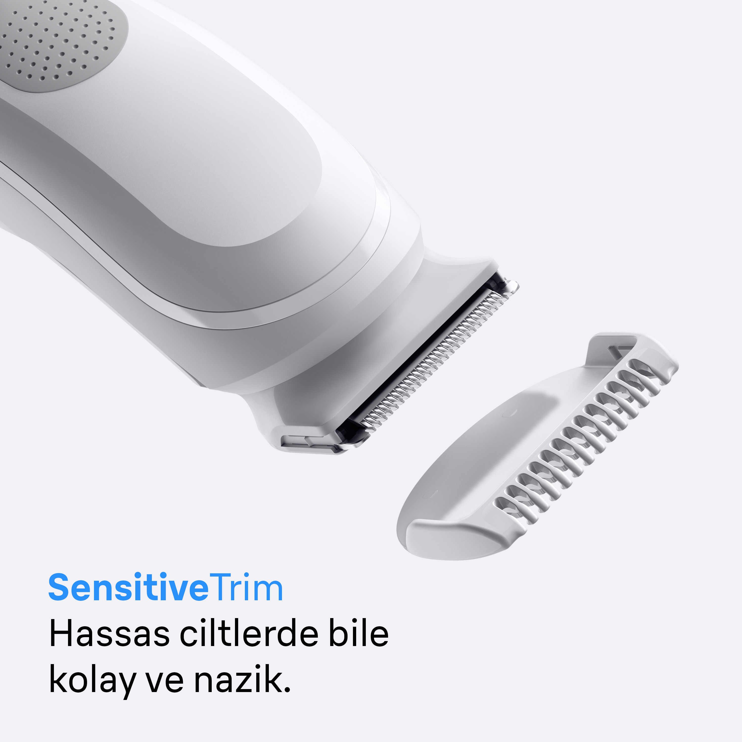 Un trimmer bianco e grigio con pettine staccato. Il testo dice 'SensitiveTrim' e una descrizione turca.
