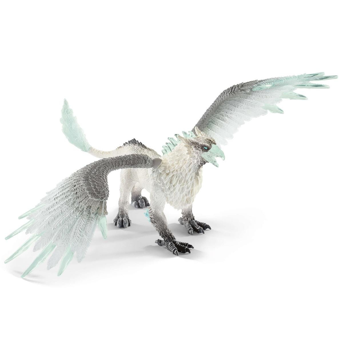 Een wit griffioen speelgoed met grijze en transparante vleugels. Het staat op een wit oppervlak, vleugels gespreid. De griffioen heeft een groene snavel.