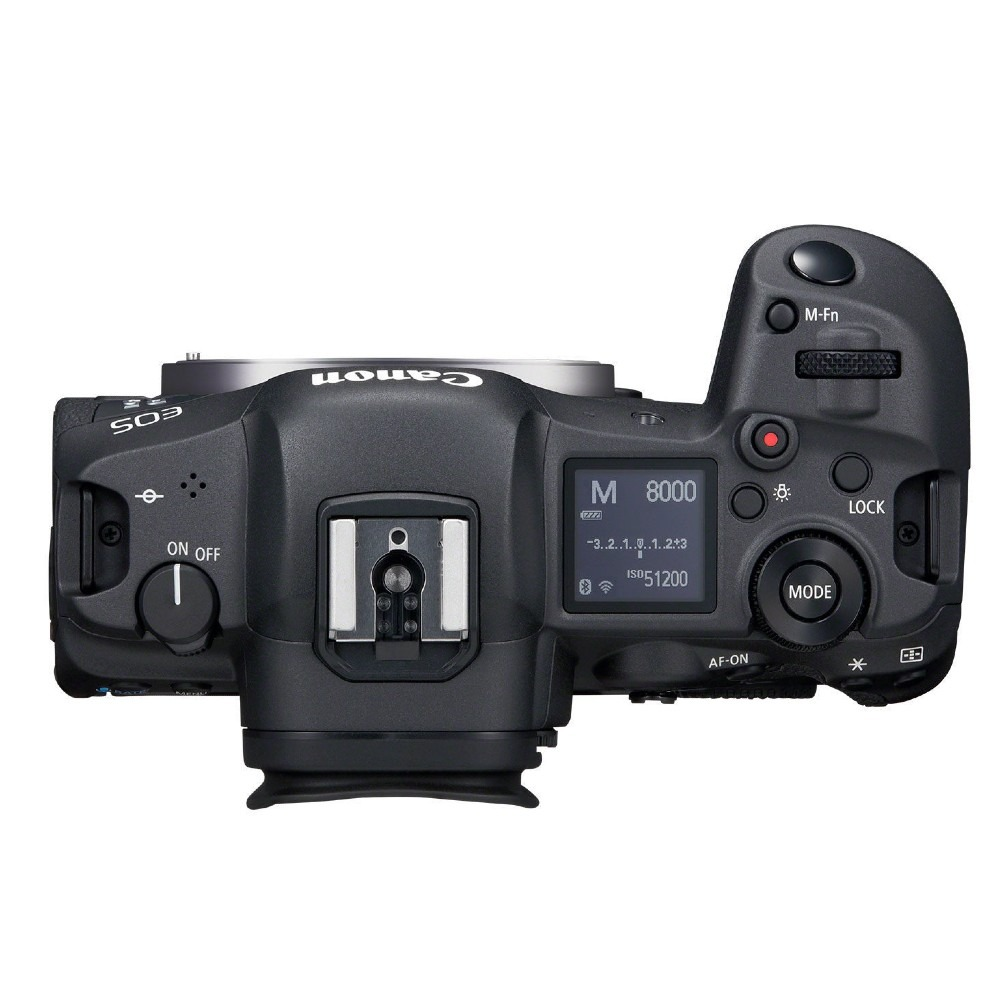 Fotocamera Canon EOS nera, vista dall'alto. Con ghiera delle modalità, display e pulsanti. Il nome del marchio è visibile.