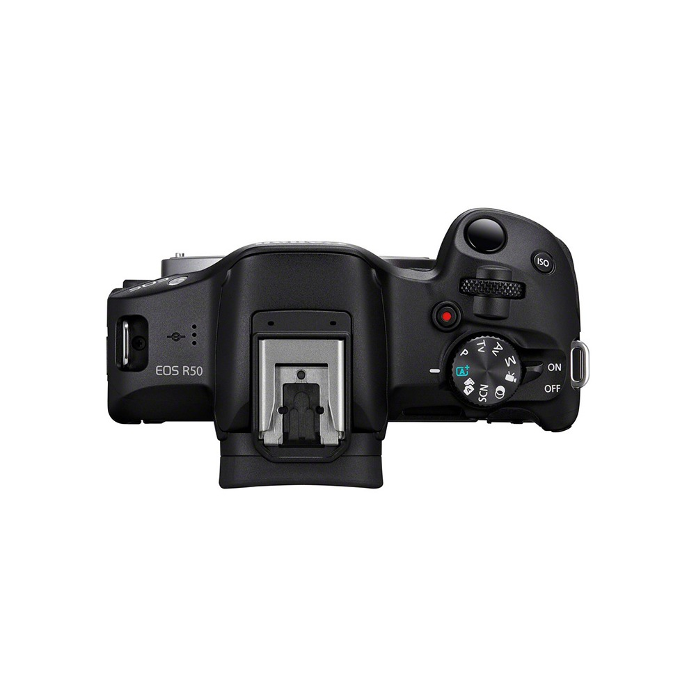 Overhead shot of a black Canon EOS R50 camera. Features a mode dial, power switch, and various buttons. The background is white.