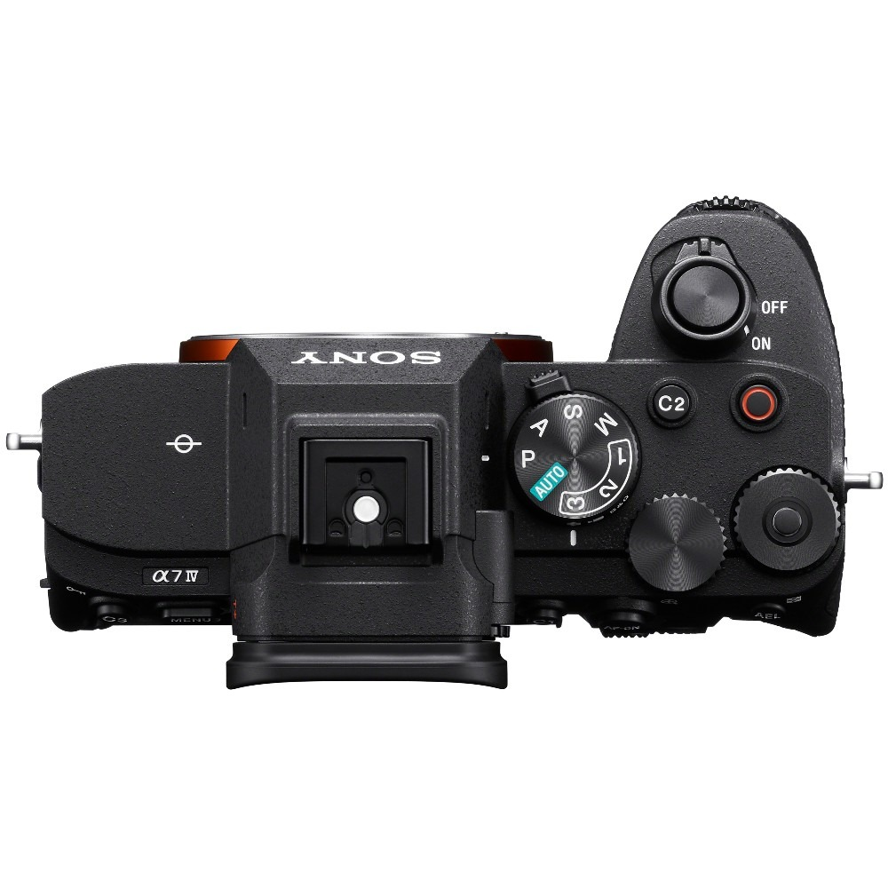 Top view of a black Sony Alpha 7 IV camera. The camera has various dials, buttons, and a hot shoe. The brand name is visible.