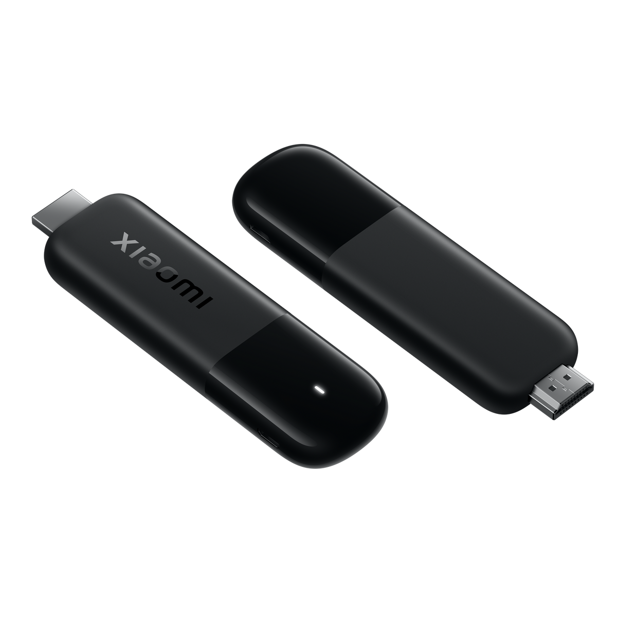 Dos dispositivos de transmisión Xiaomi negros sobre fondo negro. Uno muestra la marca, el otro tiene un puerto USB.