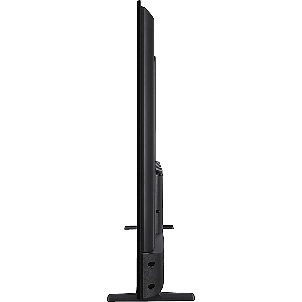 Vista lateral de un televisor de pantalla plana negro sobre un soporte. La pantalla es delgada, con base rectangular y patas.