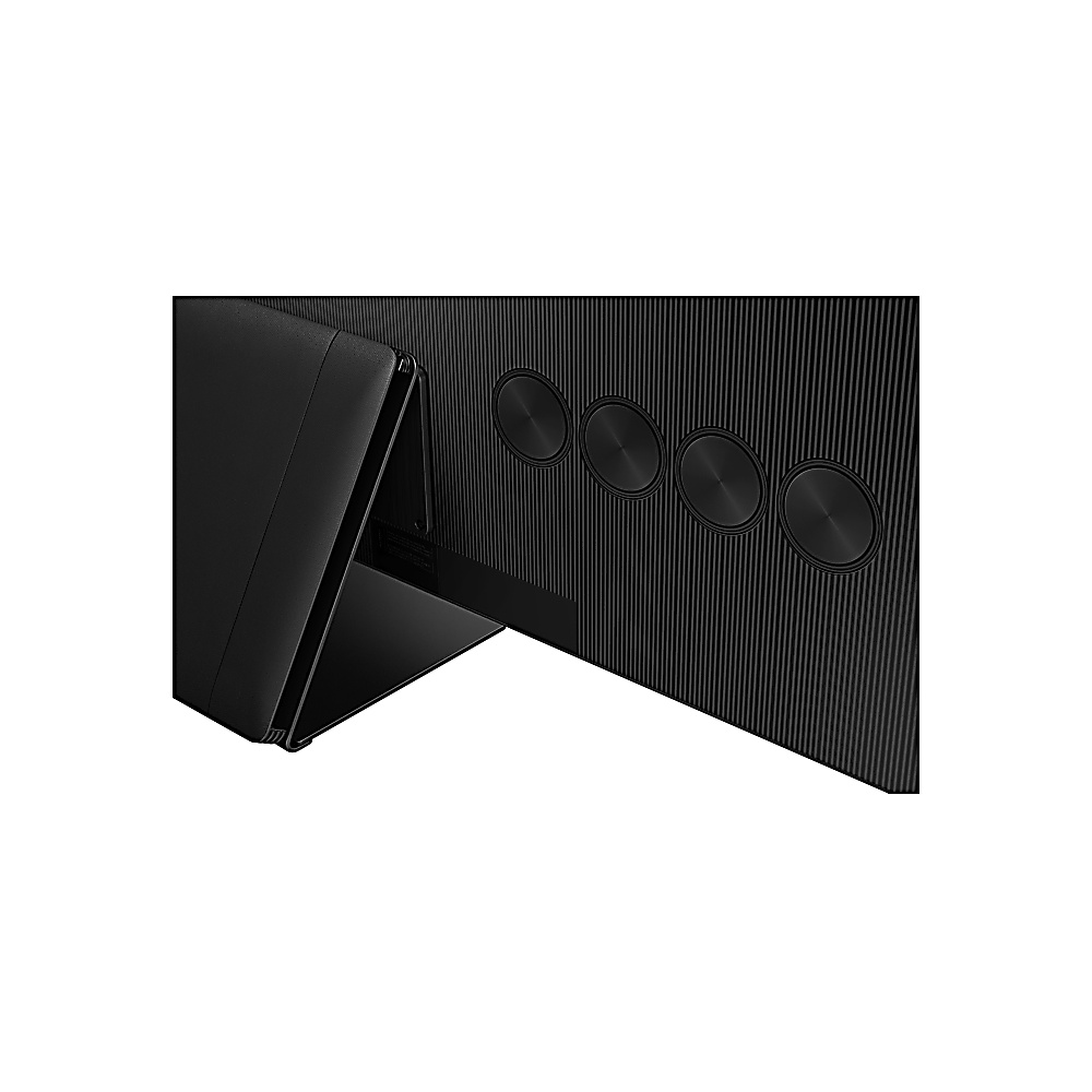 Gros plan d'un dos de téléviseur noir avec des éléments de design circulaires et un pied. Le dos a des lignes verticales.