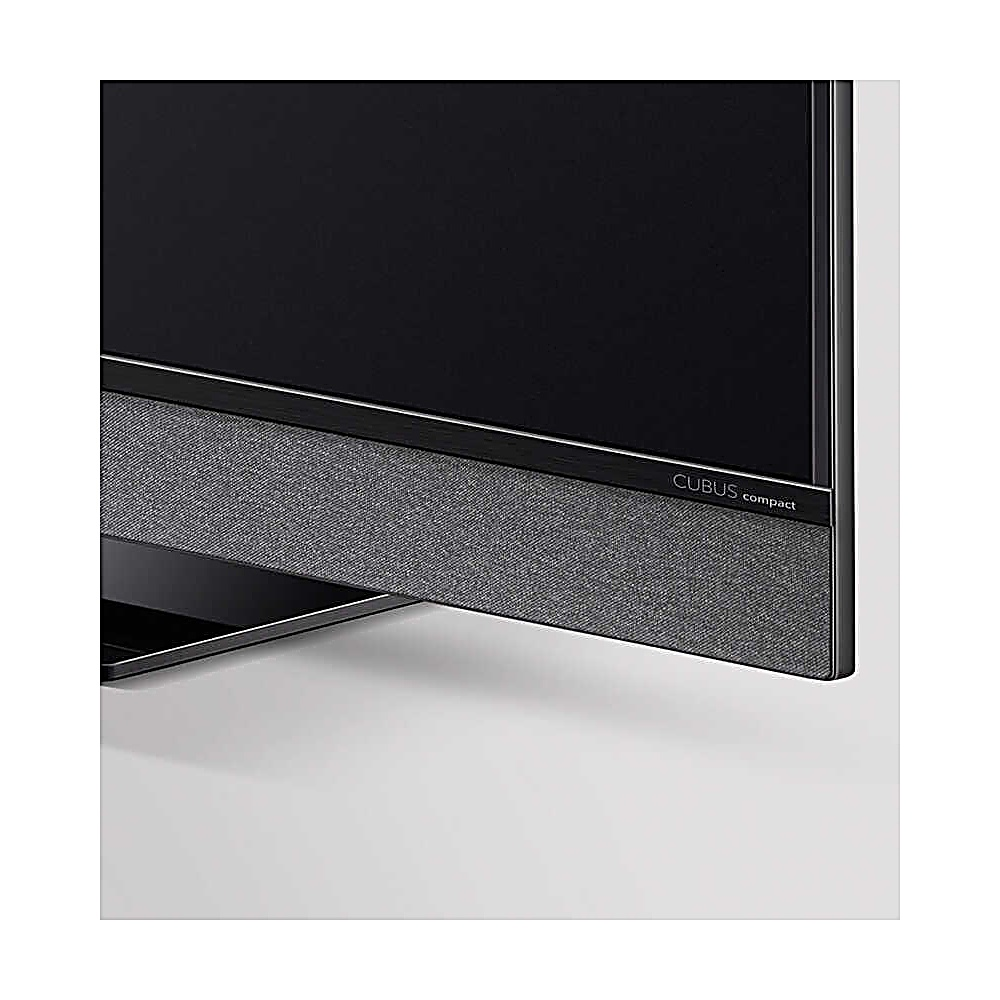 Primo piano di una TV moderna. Lo schermo è nero. Sotto, una soundbar grigia. Il testo 'CUBUS compact' è visibile.