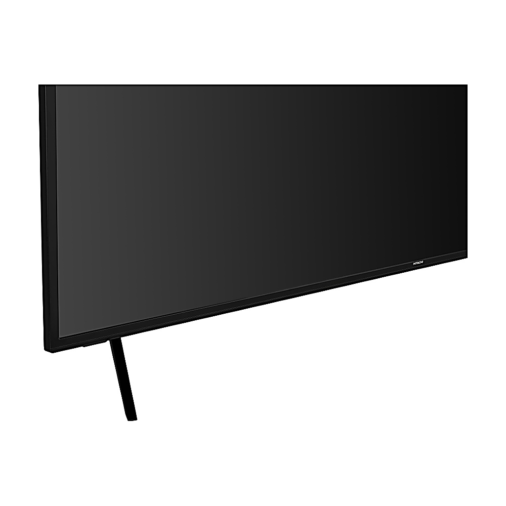 Primer plano de una pantalla de televisión negra con un soporte negro. La pantalla es grande y rectangular, con la marca Hitachi.