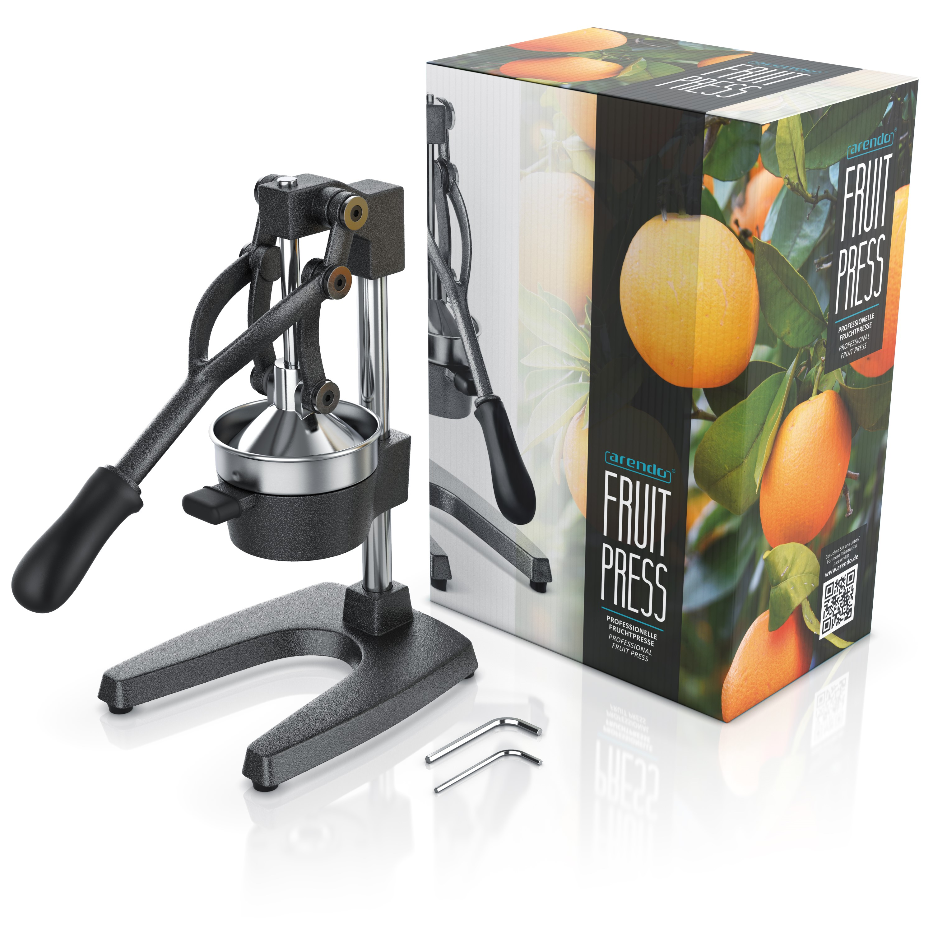 Eine Fruchtpresse und eine Schachtel mit Orangen. Presse ist schwarz und silber. Die Box zeigt Orangen und Blätter, mit Text.