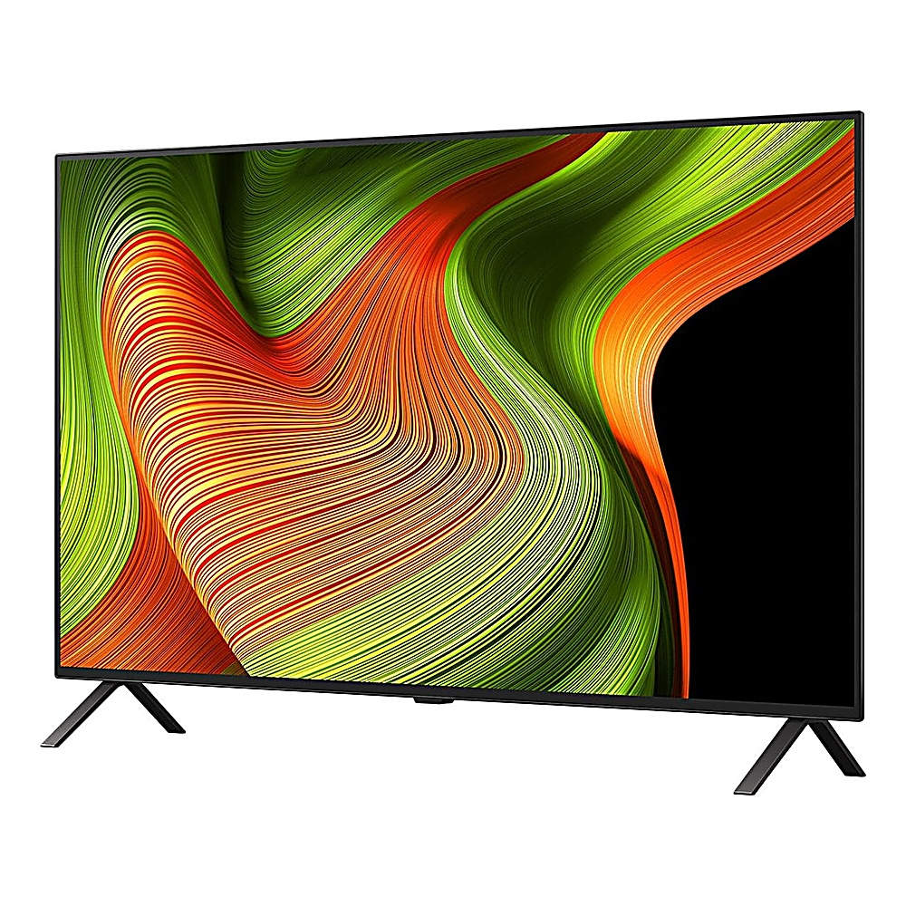 Ein Flachbildfernseher zeigt ein abstraktes Design mit orangefarbenen, grünen und gelben Wellenlinien. Der Fernseher hat schwarze Beine und einen schwarzen Rahmen.