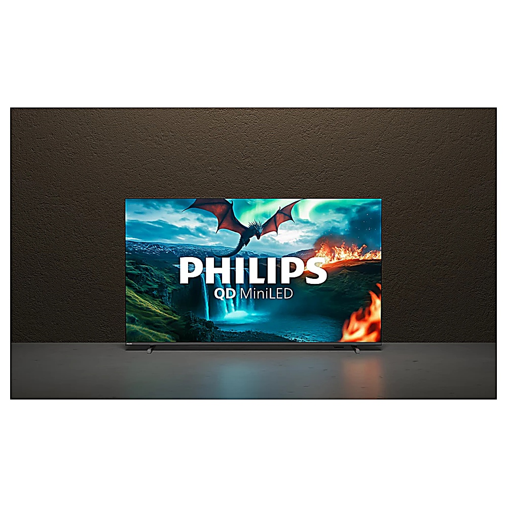 Un téléviseur Philips QD MiniLED affiche une scène fantastique avec un dragon, une cascade et du feu. Le fond est un mur sombre et texturé.