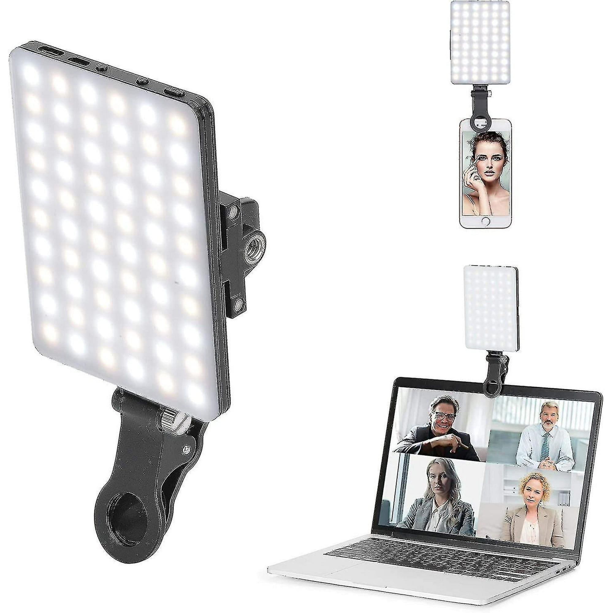 Rechteckige LED-Leuchte mit Clip an Telefon und Laptop befestigt. Der Laptop zeigt einen Videoanruf.