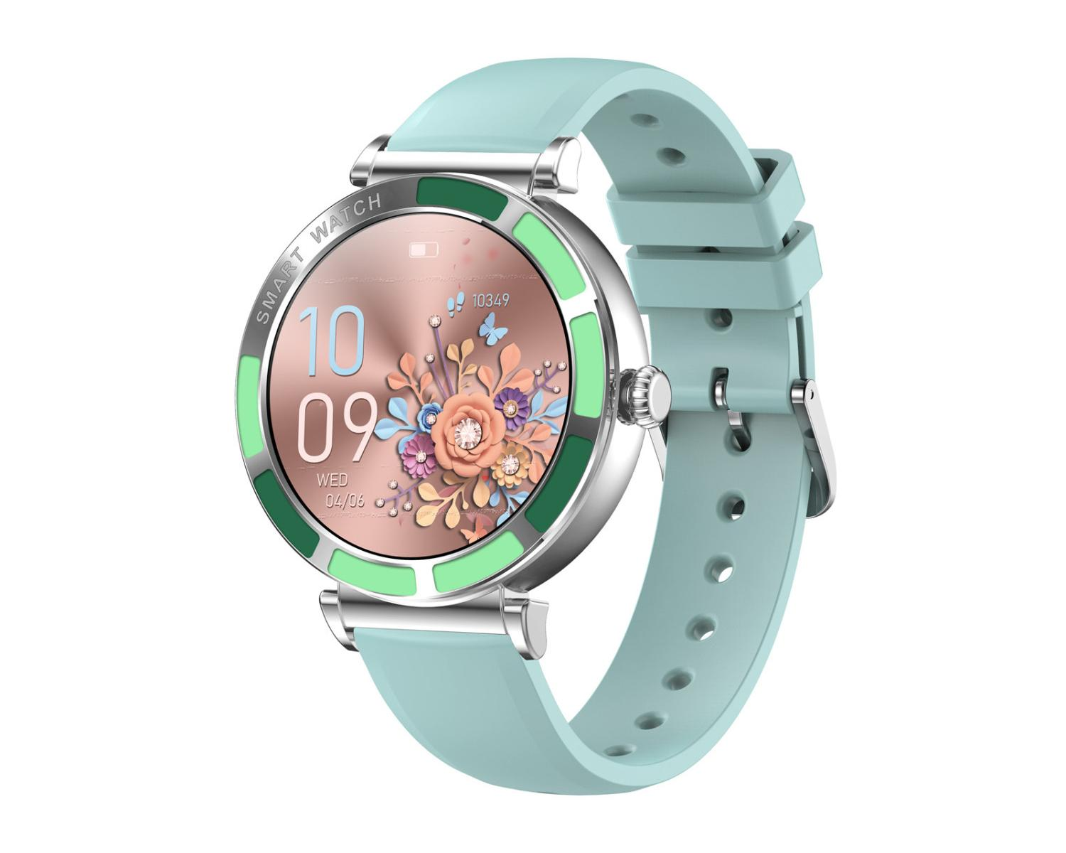 Smartwatch mit tealfarbenem Armband und silberner Lünette. Das Zifferblatt zeigt die Uhrzeit und ein Blumendesign.