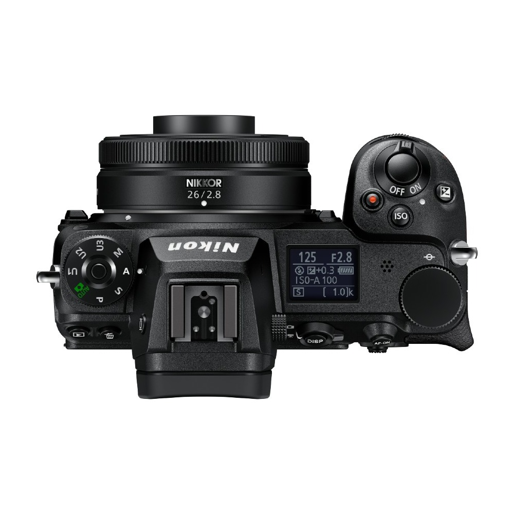 Widok z góry czarnego aparatu Nikon z obiektywem. Widoczne elementy sterujące i ekran.