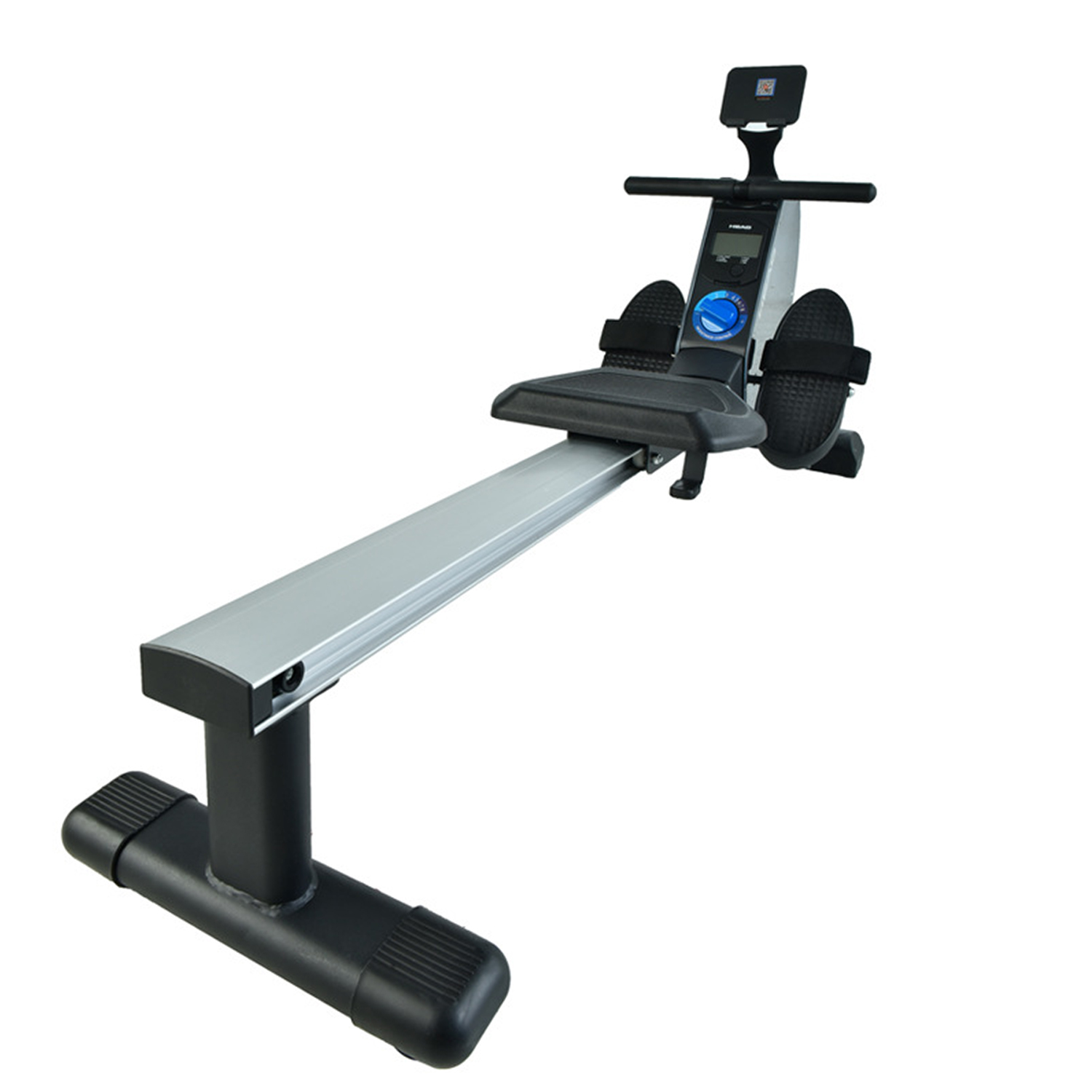 A rowing machine with a silver rail, black base, and a digital display. Footrests and a seat are visible. The background is white.