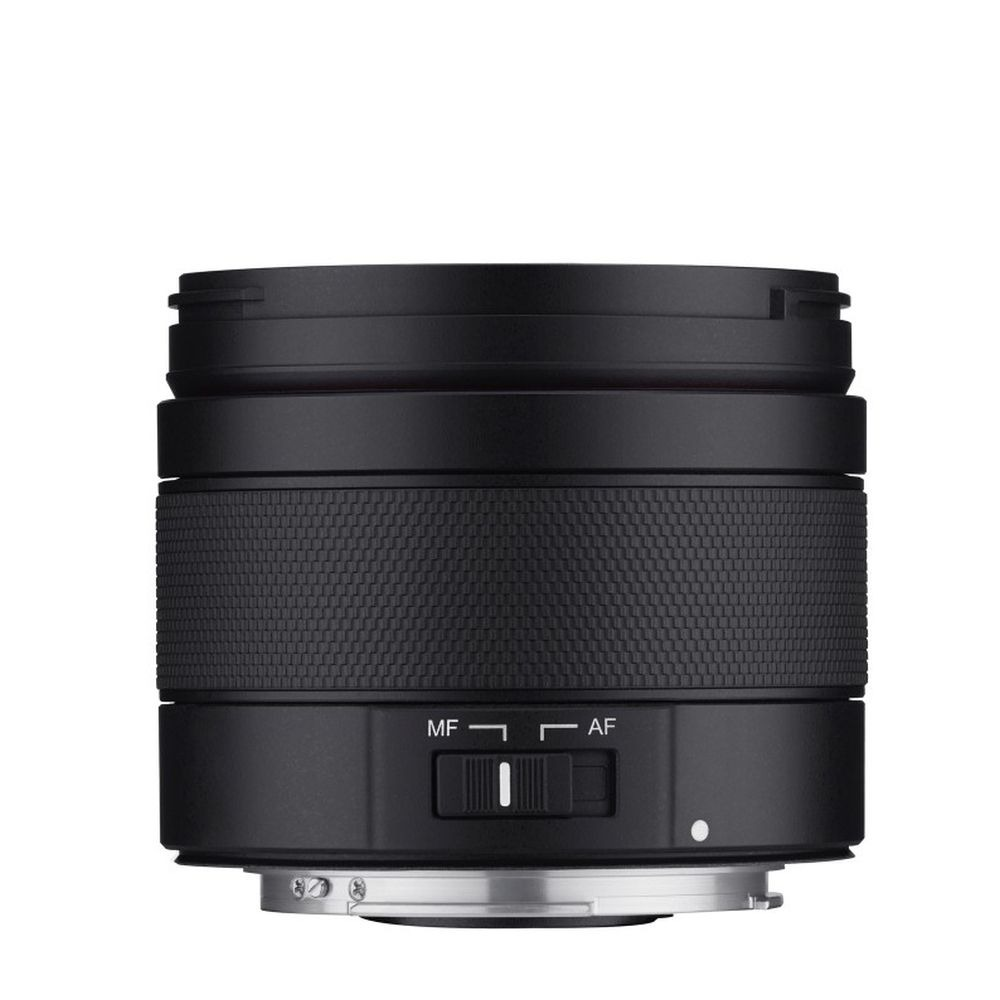A black camera lens. It has a textured grip, a focus mode switch (MF/AF), and a silver base. The background is white.