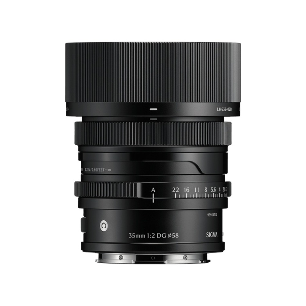 Se muestra un objetivo Sigma 35mm 1:2 DG negro. Tiene varios anillos y escalas, y el texto 'SIGMA' es visible.