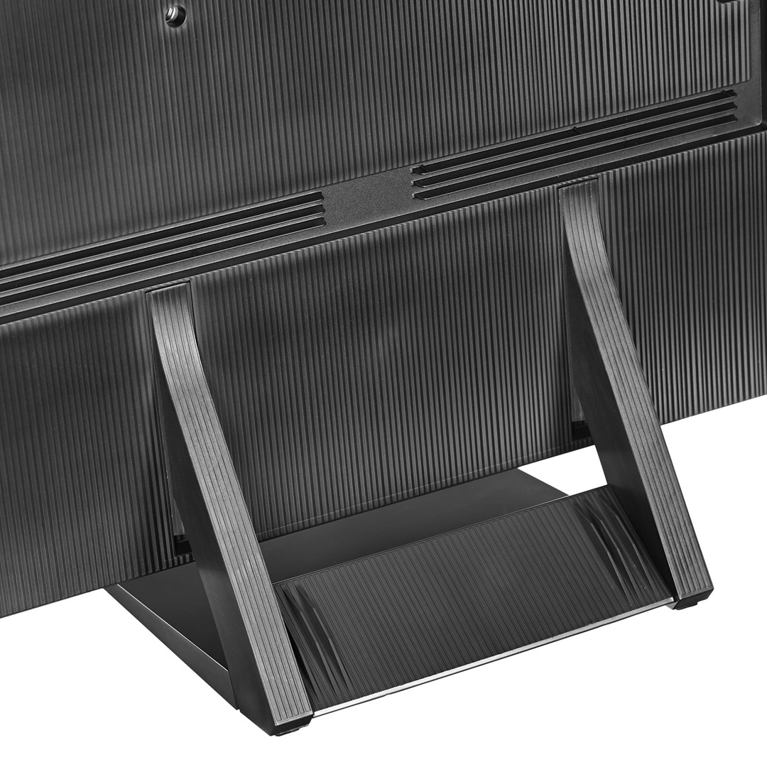 Close-up of a black TV back, showing ribbed texture. A stand supports the TV. The design is modern with a sleek, minimalist aesthetic.