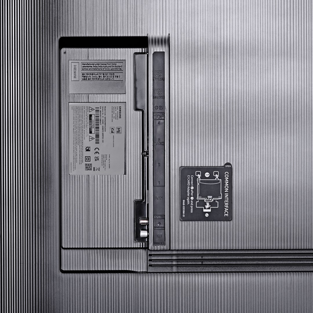 Rear panel of a Samsung TV with ports, labels, and stickers. Includes HDMI, USB, LAN, and a common interface.