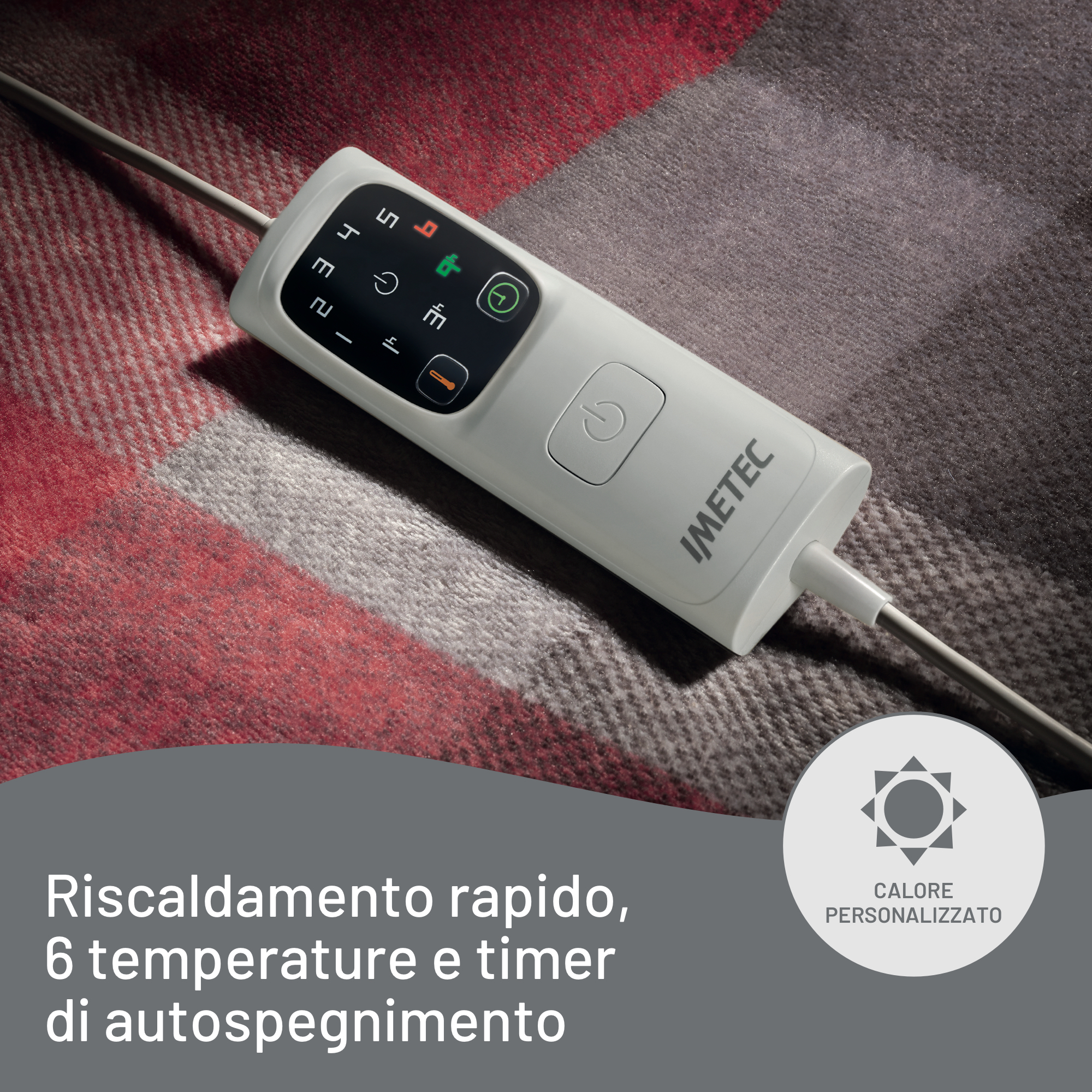 Panel de control blanco sobre manta roja y gris. Tiene botones y pantalla de temperatura. La marca es 'IMETEC'.
