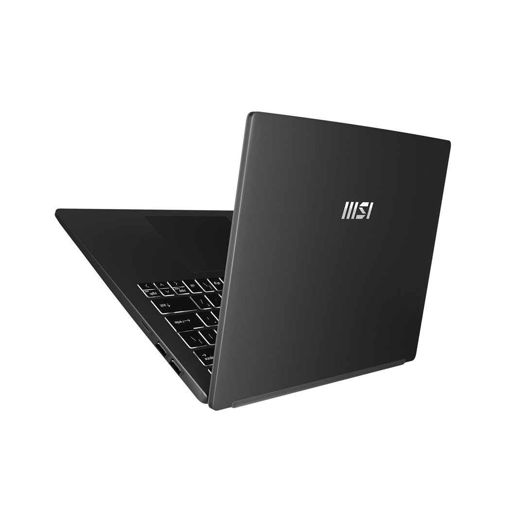 Una laptop negra está abierta. El teclado es visible. La pantalla está arriba. El logotipo de MSI está en la parte trasera.