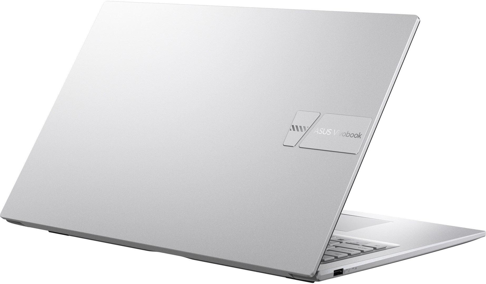 Silver ASUS Vivobook laptop. The lid is open. The logo is visible on the upper left side. The background is white.
