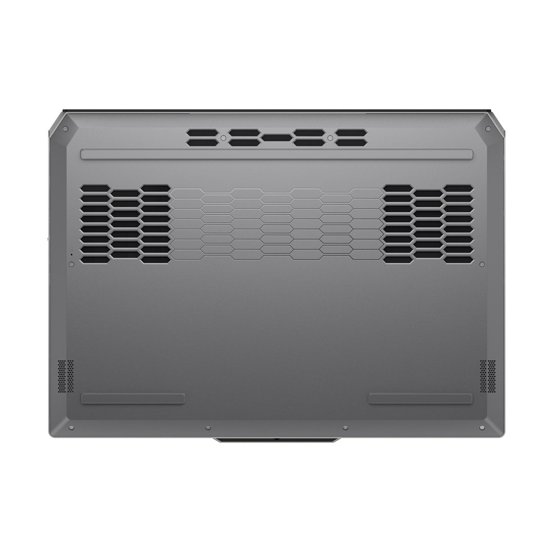 Widok z góry na szarą podstawę laptopa. Zawiera otwory wentylacyjne, kratki głośników i wzór plastra miodu.