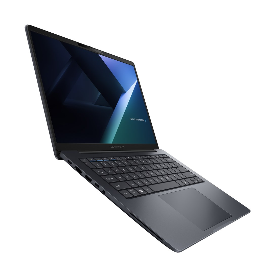 Ciemnoszary laptop ASUS ExpertBook jest otwarty, ustawiony pod kątem na białej powierzchni. Ekran wyświetla niebieski i zielony wzór.
