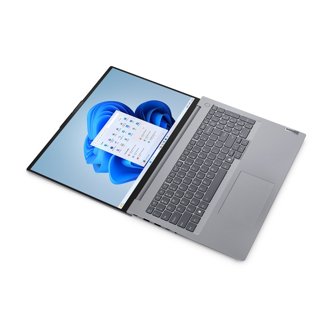 Otwarty laptop Lenovo. Ekran wyświetla Windows 11 z oknami aplikacji. Widoczna klawiatura i touchpad. Białe tło.