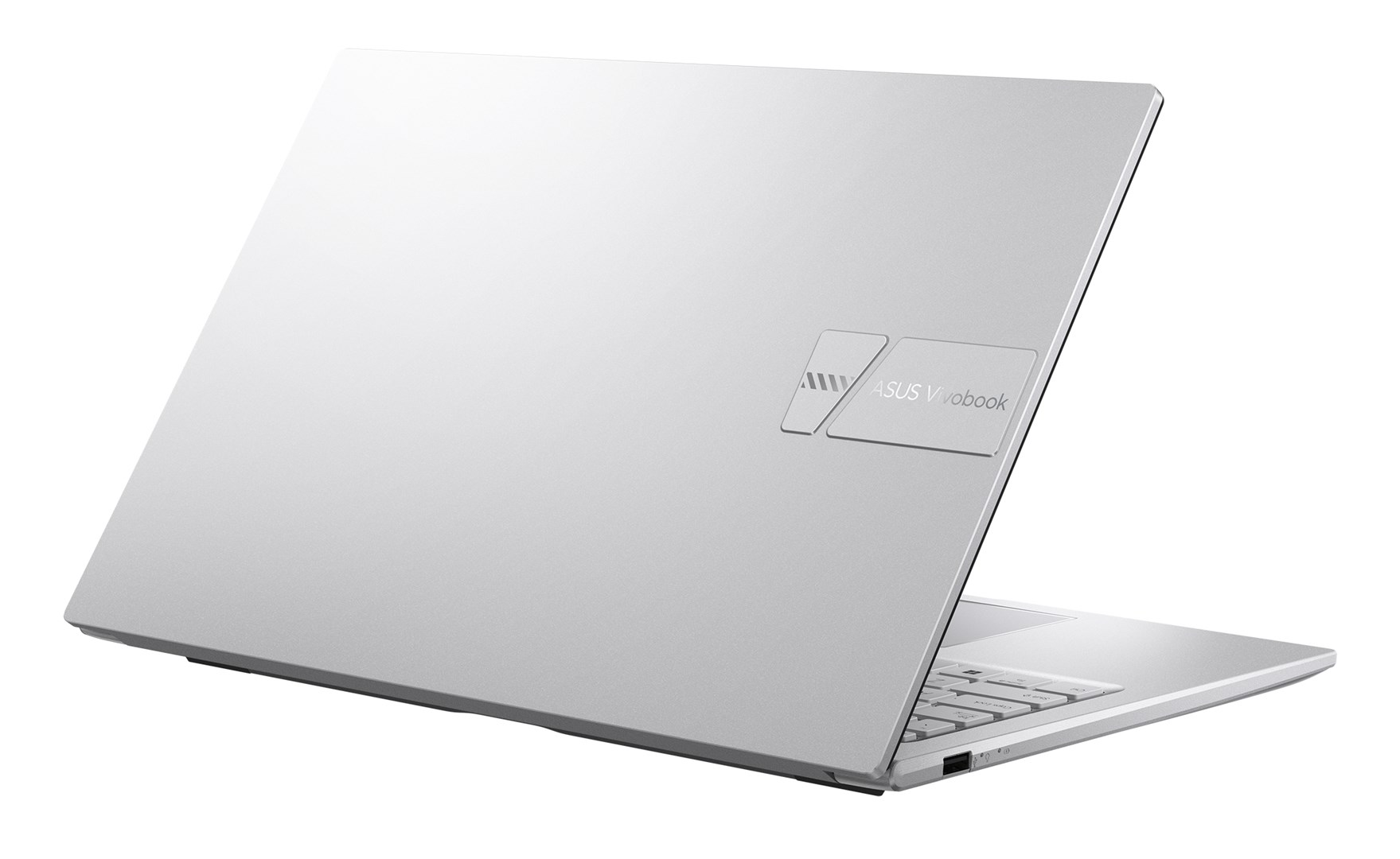 Srebrny laptop ASUS Vivobook, lekko otwarty. Widoczna klawiatura. Logo ASUS na pokrywie. Białe tło.